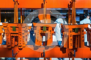 Torii gates model was hanging on rack after tourist used them for make a wish at Fushimi Inari shrine, Kyoto.