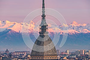 Torino Turin, Italy: cityscape at sunrise with details of the Mole Antonelliana towering over the city. Scenic colorful light on