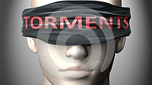 Torments can make things harder to see or makes us blind to the reality - pictured as word Torments on a blindfold to symbolize