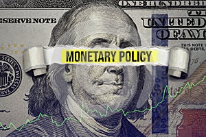 Torn bills revealing Monetary Policy words