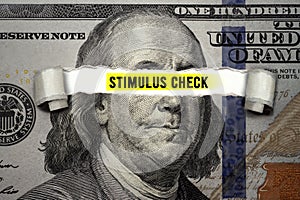 Torn bills revealing Stimulus Check words