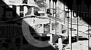 Torn black and white posters with dripping paint and shadows
