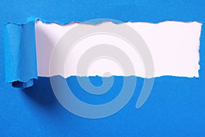 Torn blue paper strip headline white background frame