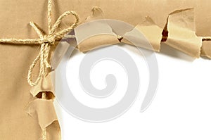 Torn brown paper parcel or package, white background, copy space