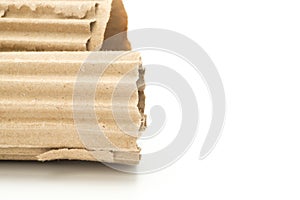 Torn corrugated cardboard on white background