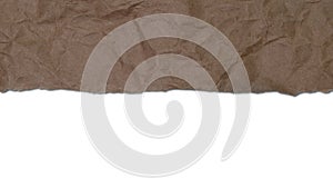 Torn, crumpled brown wrapping paper background with white copy space below