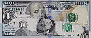 Torn 100 Dollar Banknote Over 1 Dollar Portrait