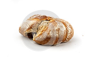Torn fresh bread on a white background