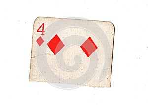 A torn half of a vintage four of diamonds playing card.