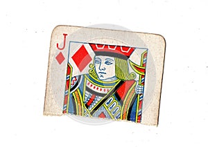 A torn half of a vintage jack of diamonds playing card.