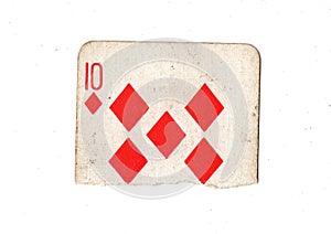 A torn half of a vintage ten of diamonds playing card.