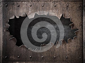 Torn hole in rusty metal steam punk background