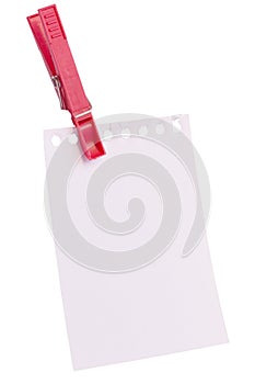 Torn-off sheet of a notebook hanging on clip