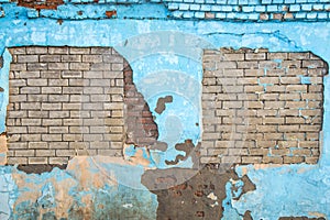 Torn old brick blue wall background