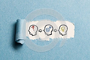 Torn paper revealing idea creation process