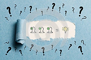 Torn paper revealing an idea creation process