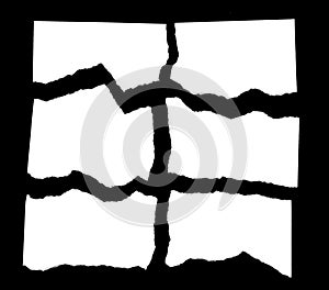 Torn Paper Scraps On Black Background