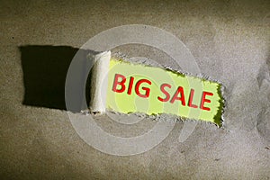 Torn paper with word BIG SALE