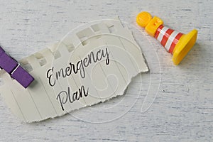 Torn paper written with text EMERGENCY PLAN