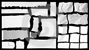Torn papers on black