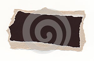 Torn piece of dark paper, background for banner. Blank paper piece message, reminder, sign, tag, label. Ripped cardboard empty