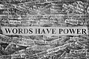 Torn pieces of paper with phrase Words Have Power