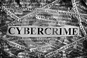 Torn pieces of paper with the word Cybercrime