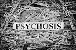 Torn pieces of paper with the word Psychosis