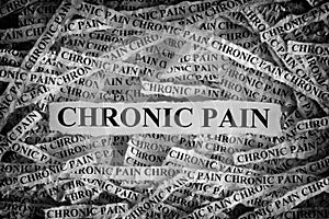 Torn pieces of paper with the words Chronic Pain