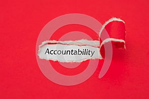 Torn red paper revealing the word of accountability concept