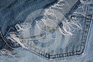 Torn and tattered old jean