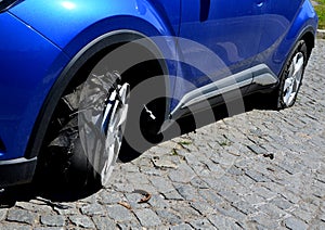 torn tire with holes in the side. the police chase ended with flat tires.