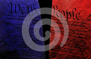 Torn US Constitution with red and blue split representing division in US politics