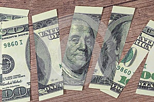 Torn 100 us dollar Franklin