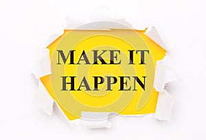 Torn white paper lies on a bright yellow background with the text MAKE IT HAPPEN