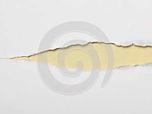 torn white paper with yellow paper background