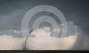 Tornado Cuts Across Farm Field photo