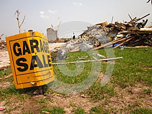 Tornado damage with garage sale sign