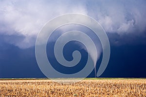 Tornado funnel cloud touching down.