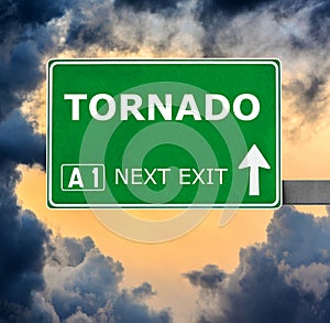 TORNADO road sign against clear blue sky