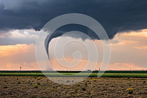 Tornado spins beneath a supercell thunderstorm