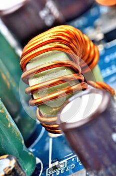 Toroidal inductance coil on circuit board - close-up