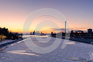 Frozen water at Ontario Place looking towards the Humber Bay Shores skyline at sunset