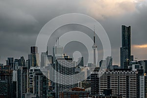 Toronto city downtown skyline, clouds over CN Tower and skyscrapers of financial district Canada photo