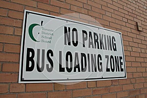 toronto district school board no parking bus loading zone sign printed in black