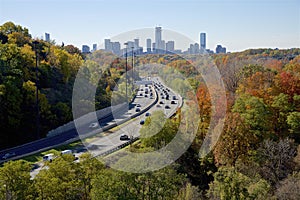 High angle view of the colorful Don Valley Parkway traffic in autumn with the downtown skyline photo