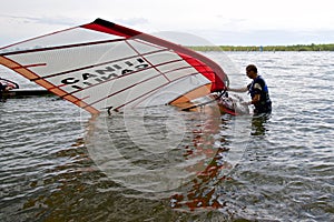 The man trying to bring up his windsurf sail, Toronto, Canada