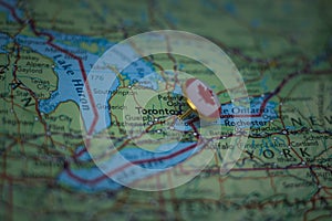 Toronto pinned on a map with the flag of Canada