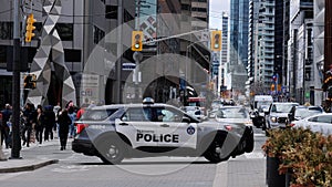 Toronto police car blocking the street in the financial district of Toronto - TORONTO, CANADA - APRIL 15, 2024