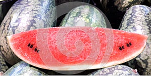 Torpedo watermelon slices, put on a pile of watermelon torpedoes.